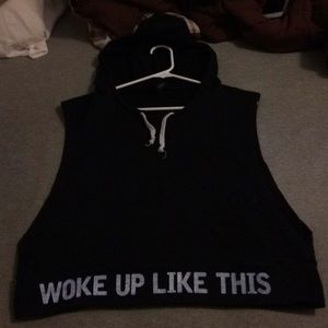 A sleeveless hoodie. Black and has a pocket.